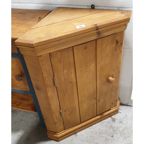 221 - A pine hanging corner cupboard, height 26.75