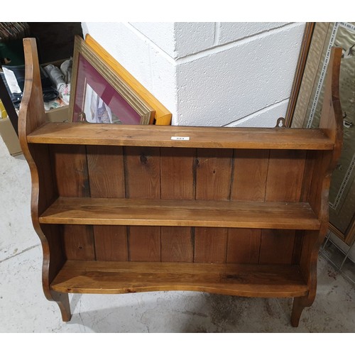 223 - A pine three tier wall shelf, width 26.25