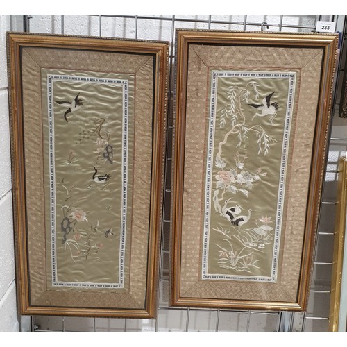 233 - A pair of silk needle works, 23.5