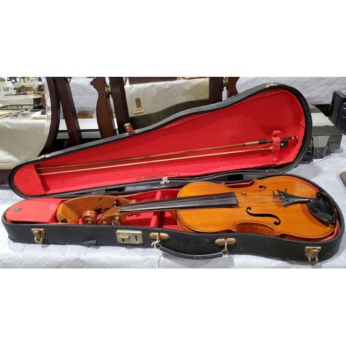 20 - A cased Dulcis et Fortis violin and bow, the back 13
