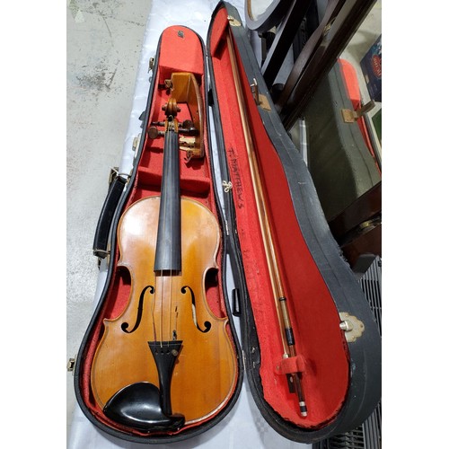20 - A cased Dulcis et Fortis violin and bow, the back 13