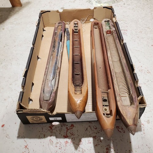 29 - Four large loom shuttles, one A/F.

UK shipping £14.