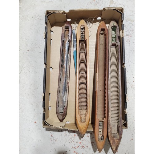 29 - Four large loom shuttles, one A/F.

UK shipping £14.
