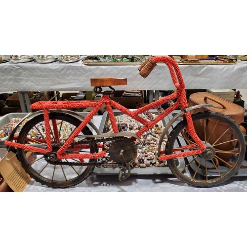 43 - A model bike covered in beads, length 19
