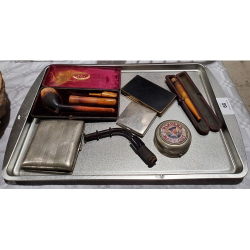 59 - A tray of smoking related items including a Cheroot holder with a 9ct gold collar.  

UK shipping £1... 