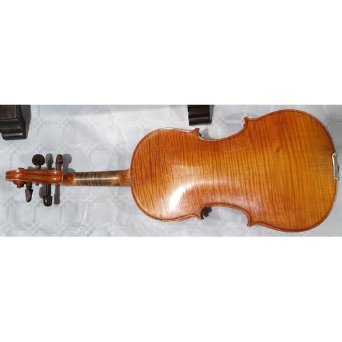 20 - A cased Dulcis et Fortis violin and bow, the back 13