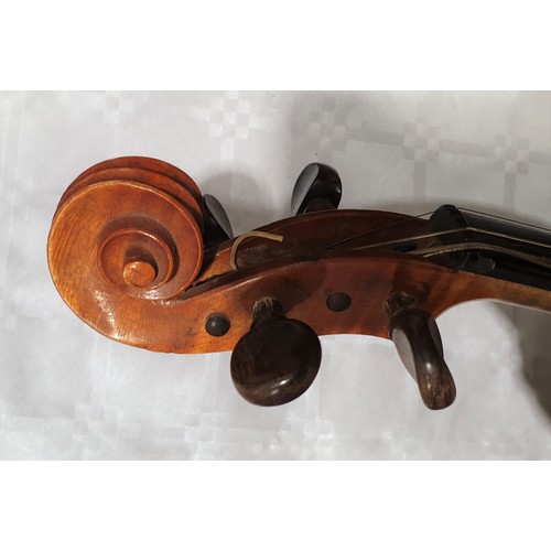 20 - A cased Dulcis et Fortis violin and bow, the back 13