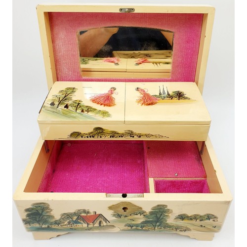 121 - Two vintage musical Japanese lacquered jewellery boxes, the widest 11