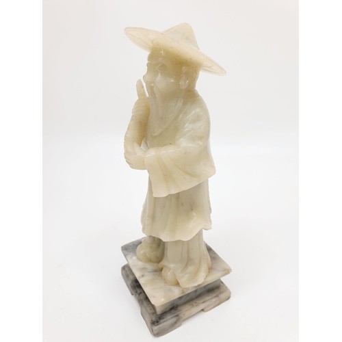 159 - A Chinese figure of a bearded man with his catch and basket, A/F, height 6.75