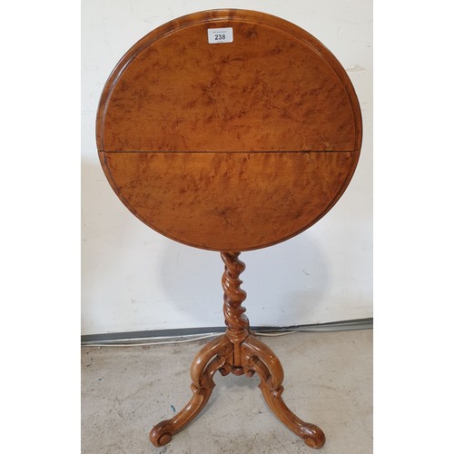 238 - An antique burr walnut tilt top occasional table, height 29.25