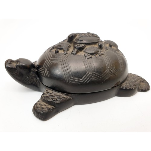 275 - A 19th century Chinese inkstone in the form of a turtle with further smaller turtles carved on its b... 