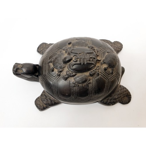 275 - A 19th century Chinese inkstone in the form of a turtle with further smaller turtles carved on its b... 