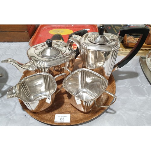 23 - An Art Deco silver plated four piece tea set. UK shipping £14.