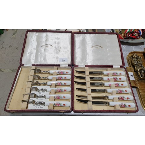 33 - A cased set of Royal Crown Derby knives and forks. UK shipping £14.