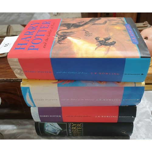 65 - Four first edition Harry Potter books. UK shipping £14.