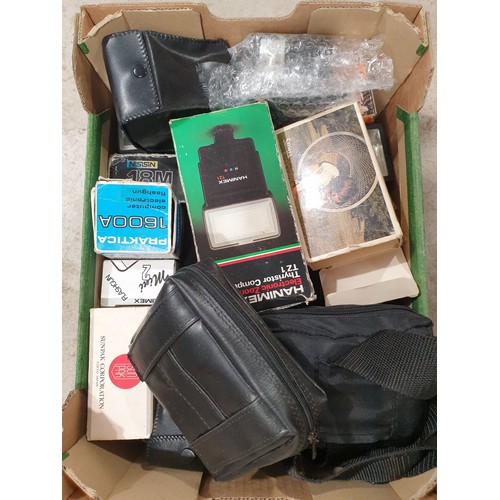 151 - A box of camera accessories. UK shipping £14.