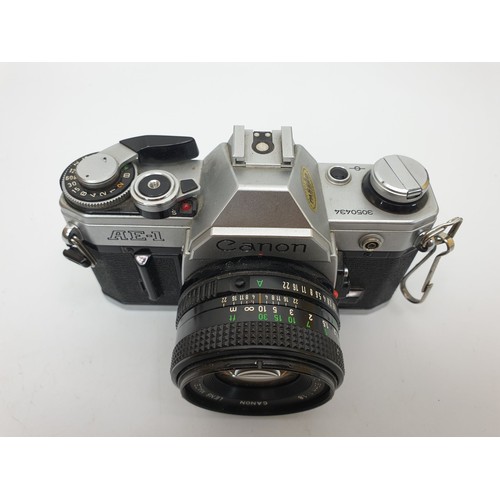 165 - A Canon AE-1 camera. UK shipping £14.