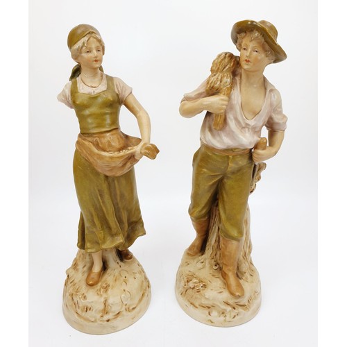 208 - A Pair of Royal Dux figures depicting a harvesting girl and boy, the girl A/F, height 11.5