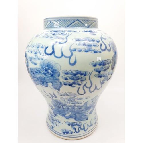 213 - A large Qing dynasty blue and white baluster shaped vase decorated with Dogs of Fo and Buddhist embl... 