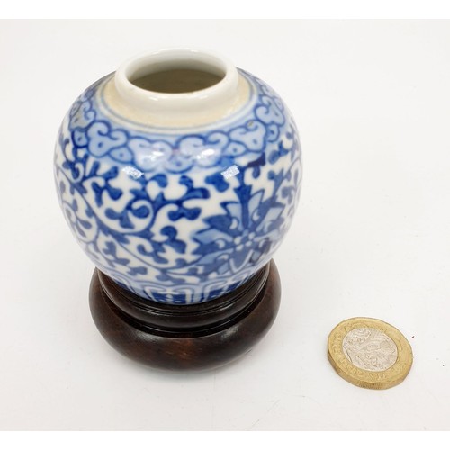 225 - A Chinese Republic blue and white vase on a wooden stand, height on stand 3.25