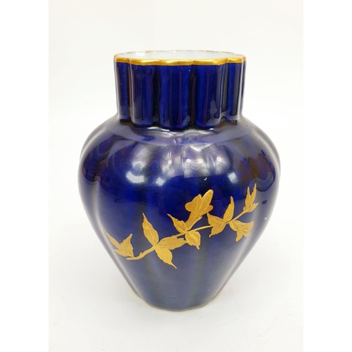 226 - An antique Royal Worcester blue ground vase with gilt branches and foliage, height 4.5