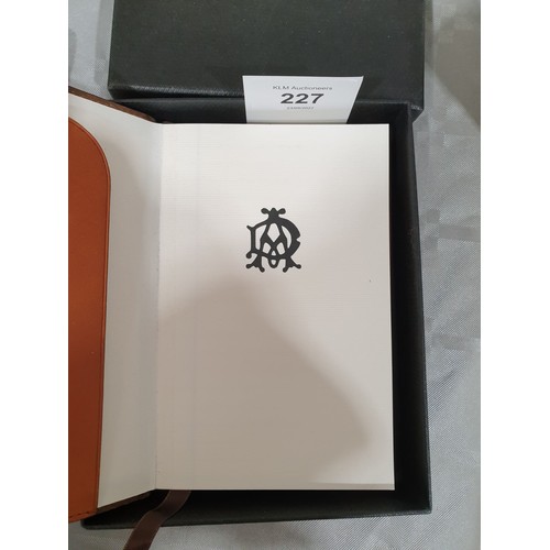 227 - A boxed Dunhill leather bound notebook. UK shipping £14.