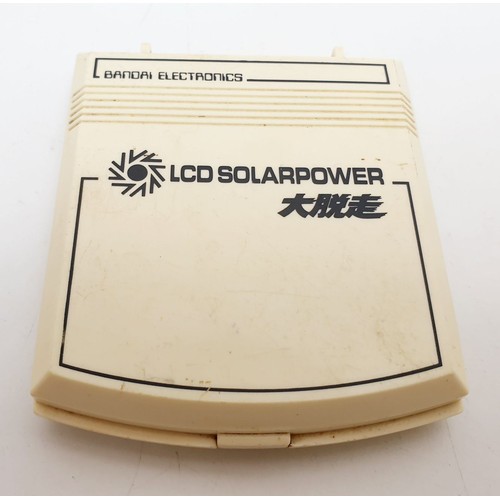 289 - A vintage Bandai Daidassou solar powered game, working order. UK shipping £14.