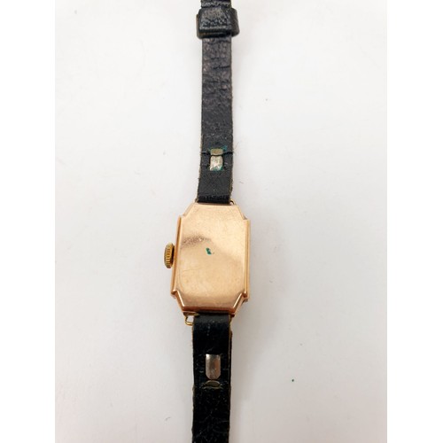 294 - A lady's 9ct gold cased wristwatch, case weight excluding movement and strap 2.5g. UK shipping £14.