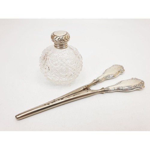 307 - Hallmarked silver handled glove stretchers, marks rubbed together with a cut glass scent bottle with... 