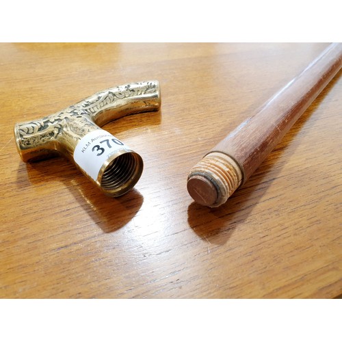 370 - A walking cane with a brass handle and an internal vile. No shipping. Arrange collection or your own... 