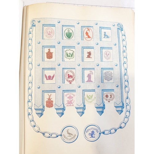 429 - An antique Crests and Monogram album with twenty one fully populated pages and three partially popul... 