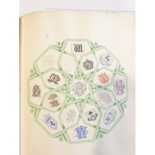 429 - An antique Crests and Monogram album with twenty one fully populated pages and three partially popul... 