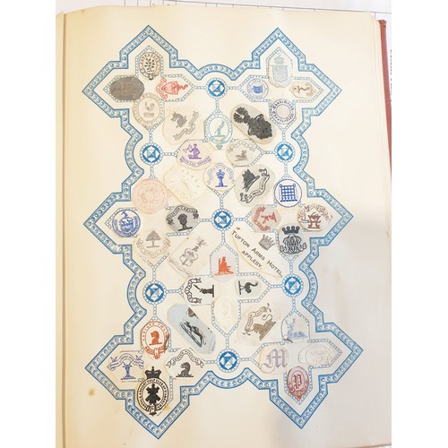 429 - An antique Crests and Monogram album with twenty one fully populated pages and three partially popul... 