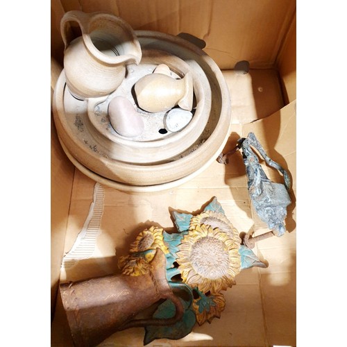 380 - A box including a cast iron door stop. No shipping. Arrange collection or your own packer and shippe... 