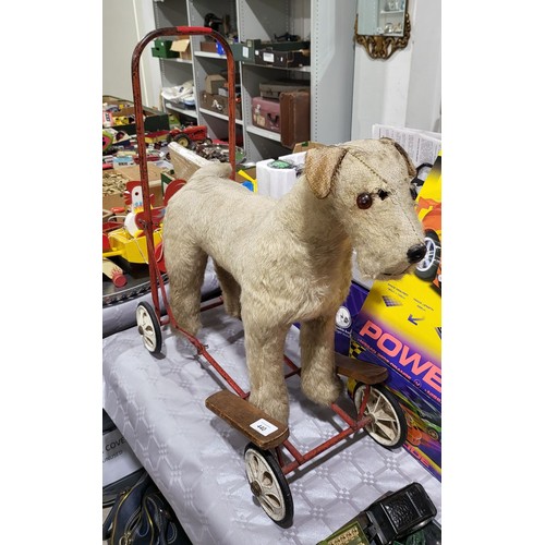 440 - A vintage Merrythought straw filled push along ride-on terrier A/F, height 24