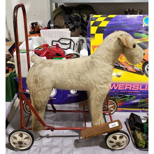 440 - A vintage Merrythought straw filled push along ride-on terrier A/F, height 24