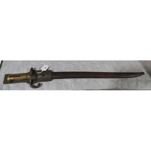 21 - A French model 1866 Chassepot bayonet together with a metal scabbard, length 27.5