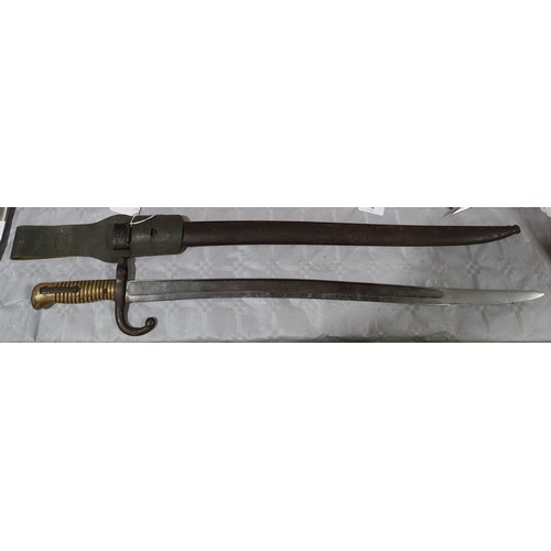 21 - A French model 1866 Chassepot bayonet together with a metal scabbard, length 27.5