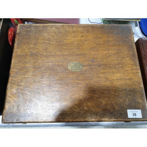 38 - A vintage oak cutlery box, width 15.75