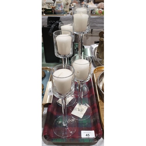 45 - Six graduated glass candle holders, the tallest 11.75