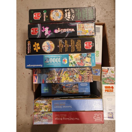 66 - A box of jigsaws. No shipping. Arrange your own packer and shipper, please.