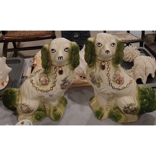 88 - A pair of Staffordshire style fire dogs, height 12