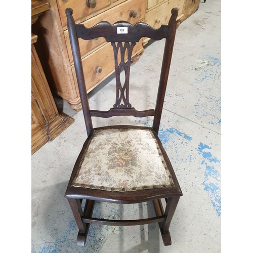 126 - An early 20th century oak rocking chair. No shipping. Arrange your own packer and shipper, please.