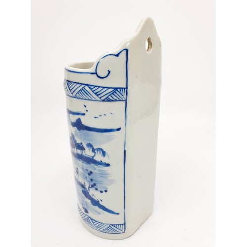 184 - A Chinese blue and white wall pocket depicting a landscape with figures, marks to the front, length ... 