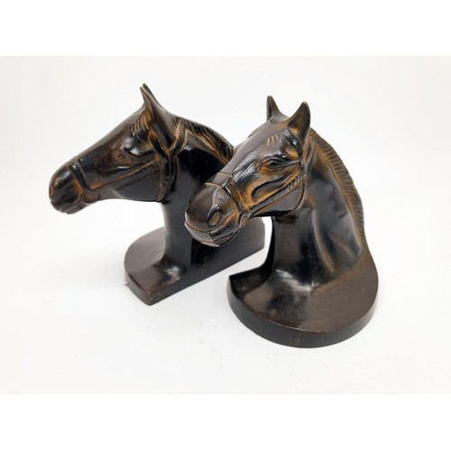 190 - A pair of cast metal bookends in the form of horse's heads, height 6.5