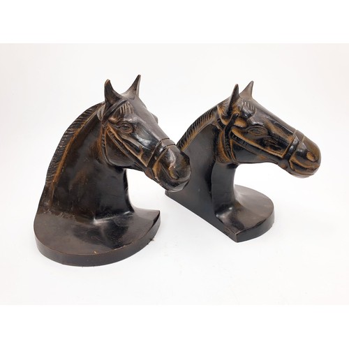 190 - A pair of cast metal bookends in the form of horse's heads, height 6.5