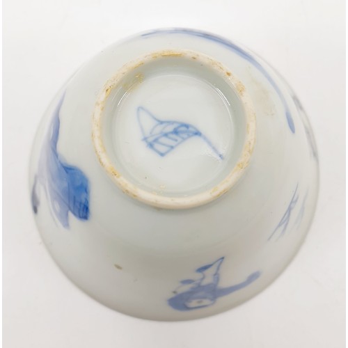 201 - A Chinese Ming style cup decorated in blue and white with figures and trees, conch shell on the inte... 