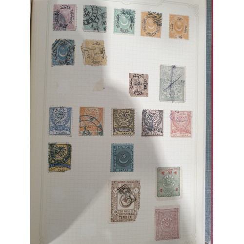 210 - A stamp album containing 19th century and later rare stamps. UK shipping £14.