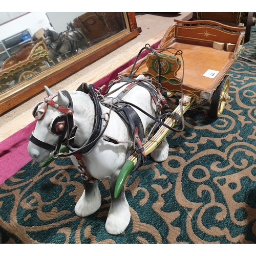 220 - A Beswick model of a shire horse with tack and cart, horse height 8.5