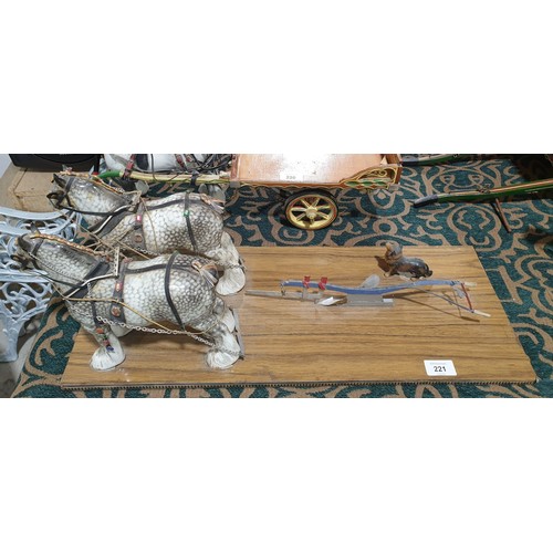 221 - Two Beswick model shire horses with tack and plough, height of horse 8.5